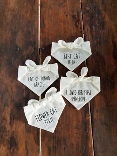 four small white bow ties with the words flower cat police and best cat pella on them