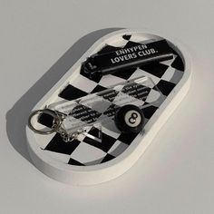 a black and white checkered board with keys in it