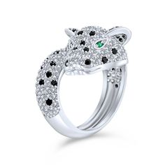 Distinctive and unique, the panther symbolizes extraordinary power. Add this powerful animal jewelry to your collection. Sparkling and playful, this puma CZ cocktail ring is a sensational gift. Made from rhodium-plated brass, it shines brilliantly. The panther's head features black and white pave stones with striking green eyes. Perfect for May birthdays or animal jewelry lovers. Enhance your collection with this fashionable and fun piece today. Panther Cat, Green Eye, Cat Ring, Bypass Ring, Animal Rings, Cubic Zirconia Jewelry, Statement Ring Silver, Cz Jewelry, Design Silver