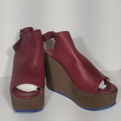 Brand: Fausto Santini Size:7.5/ 39 Color: Red & Brown Style: Dottrina Carminio Measurements: 4 In. Heel Height, 1.5 In Platform Height Condition: Nwb *Some Defects *See Pictures Flaws: Some Slight Discoloration And Scuff Marks *See Pictures, Right Shoe Inside Of Strap, Top Part Of Right Shoe Scuff, Left Shoe Inside Sole/Foot Bed Material: Soft Leather Upper, Leather Insole, Leather Lining If You’re Interested In Multiple Items, Please Send Me An Offer Or Bundle The Items. Happy Poshing! Red Wedge Sandals With Platform And Round Toe, Red Wedge Sandals With Removable Insole And Round Toe, Red Platform Wedge Sandals With Round Toe, Chic Wedge Sandals With Red Sole And Round Toe, Leather Wedge Sandals With Red Sole, Red Synthetic Wedge Sandals With Heel Loop, Red Wedge Heels With Heel Loop, Red Leather Wedge Sandals For Party, Red Wedge Heels With Stacked Heel