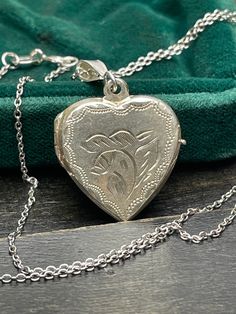 Vintage  silver locket for women. Double sided silver locket with hand engraved back and front.  Silver heart locket. Silver pendant . Silver necklace for women.       Vintage circa 50s. Mark: 925  Condition: necklace in perfect vintage condition. Materials: 925 Sterling Silver. Rhodium plated 925 silver chain.  Measure: chain 18"/ 45cm,   Locket  0.75" x 0.75"/  1.9 x 1.9 cm. Package: gift wrap available, please specify when ordering. Delivery: your order will be send by Royal Mail with trackin Vintage Hallmarked White Gold Locket Necklace, Victorian Hallmark Jewelry For Memorial, Victorian Medallion Jewelry With Hallmark, Anniversary Jewelry Locket In Medallion Shape, Victorian Memorial Jewelry With Hallmark, Victorian Jewelry With Hallmark For Valentine's Day, Hallmarked Round Locket Necklace For Anniversary, Vintage Silver Personalized Necklaces, Silver Locket For Valentine's Day