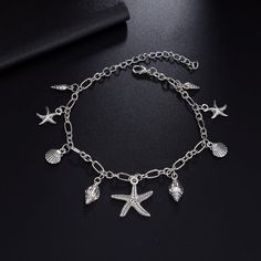 Entice Your Style with Elegance and Charm Step into summer with flair and a touch of ocean-inspired beauty with our Bohemian Starfish Pendant Anklet. Designed to accentuate your ankles with an eye-catching sparkle, this trendy anklet is perfect for beach days, casual outings, and special summer nights out. Crafted with meticulous attention to detail, this piece is not just jewelry; it's a statement of style and personality. Product Features This exquisite anklet is crafted from high-quality zinc Leg Jewelry, Starfish Anklets, Anklets For Women, Summer Anklets, Beach Anklets, Starfish Pendant, Anklet Bracelet, Shell Pendant, Ocean Inspiration