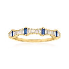 a yellow gold ring with blue and white stones