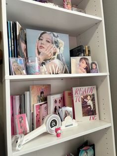 a book shelf filled with books and magazines