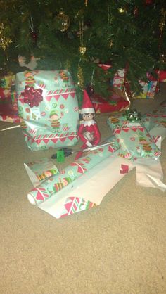 presents under the christmas tree are wrapped in paper