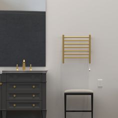 a bathroom with a vanity, stool and towel rack on the wall next to it