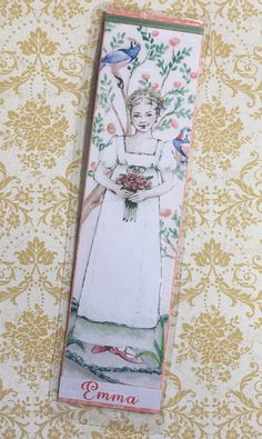 a bookmark with an image of a woman holding flowers