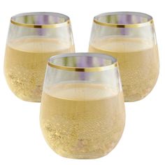 three wine glasses with gold rims sitting next to each other