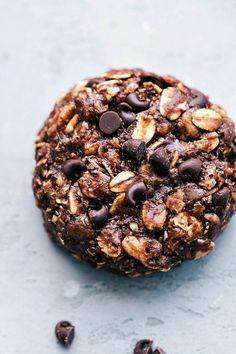 a cookie with chocolate chips and nuts on top