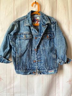 1990's St Michael denim jacket age 7-8 Fabulous unisex denim jean jacket. It has everything you need -acid wash/pockets/random labels. Thick denim, will only get better and better with wear. True to size Chest-32" Length-21" Retro Cotton Acid Wash Denim Jacket, Retro Acid Wash Cotton Denim Jacket, Retro Pre-washed Denim Jacket, Vintage Acid Wash Denim Jacket For Streetwear, Acid Wash Retro Denim Jacket, Acid Wash Vintage Denim Jacket With Pockets, Vintage Acid Wash Denim Jacket With Pockets, Retro Acid Wash Denim Jacket, Vintage Acid Wash Denim Jacket For Spring