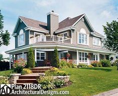 a large house sitting on top of a lush green field