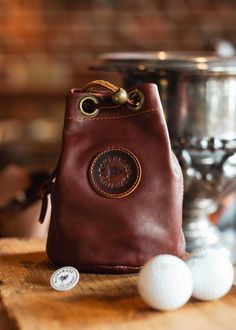 Our Essentials Leather Golf Pouch is made with Premium American leather hides. Store your Wallet, Keys, Flask or any other items during your round. Tough, rugged, durable and built to last. Vegetable-tanned leather embossed logo on the front or initials if you choose.All our bags are handmade in the USA and designed with care and attention to detail. The pouch measures approximately 6” Tall X 5" Wide Everyday Carry Pouch With Coin Pocket, Brown Pouch With Coin Pocket For Everyday Carry, Leather Pouch With Coin Pocket For Everyday Carry, Brown Leather Outdoor Pouch, Outdoor Brown Leather Pouch, Leather Hides, American Leather, Leather Hide, Custom Monogram