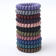 Non-marking Spiral/Coil Hair Ties Matte Multi-color pack (11 big hair ties in a pack) Material: Plastic Which hair type is it good for?✔ Straight✔ Wavy✔ Curly✔ Coiled✔ Tightly Coiled Suggested Usage: -Wrap around your hair two to three times, as desired.-For big pineapples and voluminous pineapples, only wrap once. 𝐂𝐮𝐫𝐥 𝐂𝐨𝐢𝐥𝐬 help to prevent tangling and hair breakage that many hair ties cause. The spiral, telephone cord design spreads the pressure of the hair elastic out over a greater Coil Hair Ties, Matte Hair, Hair Coils, Hair Supplies, Hair Accessories Collection, Spiral Shape, Elastic Hair Ties, Spiral Design, Hair Rings