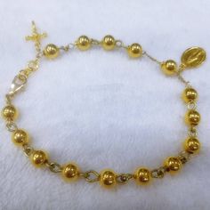 This bracelet has designed by Korean sister for her mother. Her mother lost his husband 2 months ago so daughter want to give some special gift as a Catholic. 24k gold 6mm ball has weaved by 18k solid gold wire. Crucifix and miraculous medal are 999% gold purity of 24k gold. For the safety reason, I am using 18k gold clasp,18k gold chain. Express tracking parcel will be used for delivery. If customer want lower cost and no taxes, please use my local webstore. * Material : 24K Solid gold & 18 Spiritual Gold Bracelet With Round Beads, Elegant Gold Rosary As Gift, Elegant Gold Rosary For Gift, Gold Rosary Bracelet With Gold Beads As A Gift, Gold Rosary Bracelet With Round Beads Gift, Gold-plated Rosary Bracelet For Gift, Yellow Gold Rosary Bracelet With Gold Beads As Gift, Gold Hypoallergenic Rosary Bracelet With Round Beads, Spiritual Gold Bracelet With Round Beads As Gift