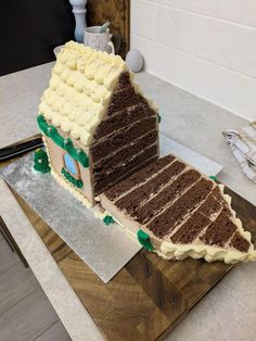 a large slice of cake sitting on top of a cutting board