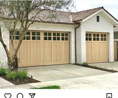 two garage doors on the side of a house