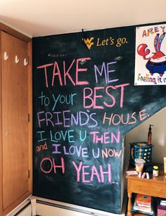 a blackboard with writing on it in a room