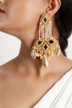 22kt gold finish earrings with all over hand embroidered mirror, pearls, beads, thread work Type: Mirror, Pearls, Beads, Thread Composition: Brass Color: Gold, Cream Other Details:  Nickel Free: Yes Dimensions (in cm): Length: 13 Width: 5.5 Weight (in gms): 0.76 - Aza Fashions Flower Jewellery For Haldi, Western Jewellery, Esthetics Room, Embroidered Earrings, Diy Wire Earrings, Diy Jewellery Designs, Mirror Embroidery, Sculptural Jewelry, Ear Accessories