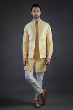 Yellow cream bundi with all-over floral 3D embroidery and band collar. Comes with kurta and white pant.
Component: 3
Embroidered
Neckline: Band Collar
Sleeve Length: Kurta: Full; Bundi: Sleeveless
Fabric: Moga Silk, Cotton Silk
Color: Yellow
Dabka embroidery
Embroidered kurta
Front button placket
Straight fit pant - Aza Fashions Muga Silk, Yellow Kurta, Chikankari Embroidery, Kurta Set For Men, Straight Fit Pants, Nehru Jackets, Yellow Cream, Embroidered Neckline, Indian Fashion Designers