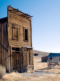 an old wooden building in the middle of nowhere