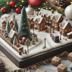 a christmas village is displayed on a tabletop