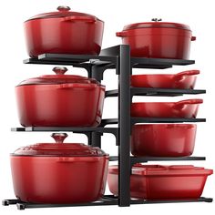 red pots and pans are stacked up on a black rack against a white background