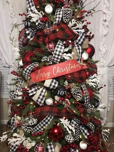 a christmas tree decorated with red, black and white ornaments