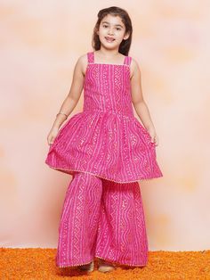 **Specifications : Please visit our brand store** https://www.etsy.com/in-en/shop/AJDezines?ref=seller-platform-mcnav .Kurta Fabric - Cotton | Sharara Fabric - Cotton .Package Content - 1 Kurta, 1 Sharara ||Style:- Kurta Sharara Set For Kids Girls .Top Details : Sleeveless , Bandhani Print, Square Neck, Cotton Fabric Bottom Details : Cotton Fabric, .Bandhani Print, .Specially Crafted Ethnic Set for the perfect look and comfort for the Summer Festive Season .Occasion: The Perfect set for Your You Navratri Party Kurta With Bandhani Print, Party Kurta With Bandhani Print For Festivals, Festive Cotton Dress For Celebration, Festive Cotton Celebration Dress, Festive Cotton Dresses For Diwali, Traditional Bandhani Print Dress For Parties, Traditional Bandhani Print Party Dress, Pink Sleeveless Dress For Navratri, Sleeveless Pink Dress For Navratri