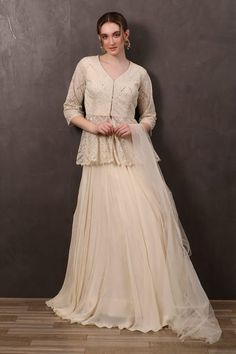 Off-white net lehenga with an attached cancan and pleated detailing. Comes with a thread, sequins and mirror embroidered kurta and a dupatta. - Aza Fashions Cream Fitted Sets With Sheer Dupatta, Fitted Net Anarkali Set For Wedding, White Organza Lehenga For Formal Occasions, Lace Work Sharara For Wedding And Navratri, White Organza Lehenga For Formal Events, Wedding Georgette Sets With Lace Work, Wedding Sharara With Lace Work For Navratri, Elegant Fitted Net Lehenga, Wedding Sets With Lace Work In Georgette