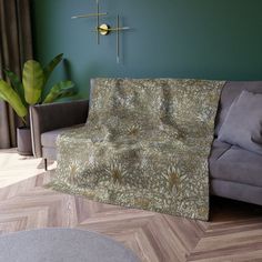 a living room with green walls and wooden floors