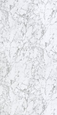 a white marble textured surface with grey streaks