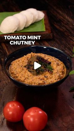 tomato and basil hummus in a black bowl with text overlay that reads tomato mint chutney