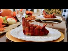 the table is set for thanksgiving dinner with napkins on it