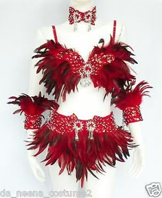 a woman's red and white costume with feathers on the chest, headpieces and bra