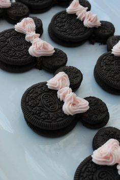 some cookies with frosting on them sitting on a plate