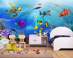 an ocean scene with fish and sea animals on the wall, along with other marine creatures