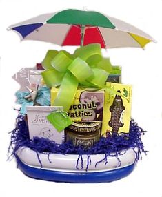 a gift basket with an umbrella and various items