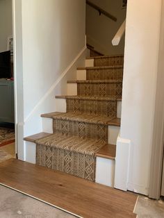 the stairs in this house are made of wicker and have been painted with white paint