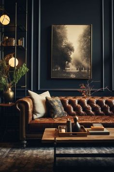 a living room with leather couches and paintings on the wall above them, along with other furniture