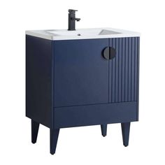 an image of a bathroom sink with blue cabinet and faucet on the side