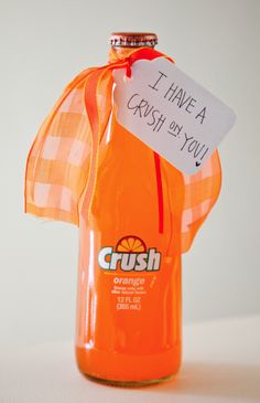 an orange crush soda bottle with a sign attached to it