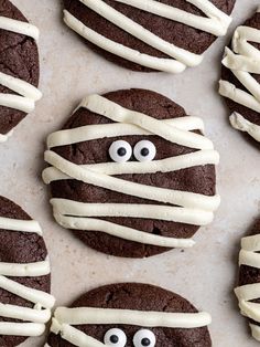 chocolate cookies decorated with white icing and googly eyes