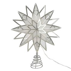 a white star shaped lamp on top of a metal stand with a wire attached to it