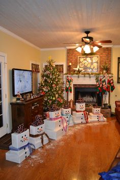 a living room decorated for christmas with presents on the floor