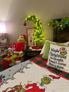 a bed room with a neatly made bed and two christmas themed bedspreads