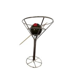 a metal stand with two balls on it and sticks sticking out of the top one