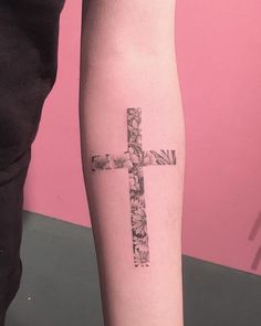 a person with a cross tattoo on their leg