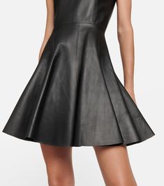 Leather minidress in black - Alaia | Mytheresa Luxury Leather Dresses For Formal Occasions, Fitted A-line Leather Dress, Fitted Leather Mini Dress, Mini Length Leather Dress, Luxury Leather Work Dresses, Luxury Leather Workwear Dresses, Luxury Leather Dresses For Work, Modern A-line Mini Dress For Party, Sleek Fitted Leather Mini Dress