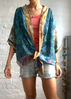 This is colourfull light silk kimono shirt made of different vintage silk materials unisex style, made for both men and woman nice looking with skirt as well as trousers or shorts and can be used all year round as a cover up layered over a long sleeve hippie boho style, great for summer festivals, parties or every day free size more available at https://www.etsy.com/shop/AltheaStores?ref=seller-platform-mcnav Thank you for looking Summer Patchwork Lagenlook Blouse, Lagenlook Patchwork Blouse For Summer, Multicolor Patchwork Blouse For Vacation, Multicolor Patchwork Summer Blouse, Bohemian Silk V-neck Top, Bohemian Patchwork Blouse For Spring, Bohemian Spring Blouse With Patchwork, Summer Beach Blouse Lagenlook Style, Bohemian Spring Patchwork Blouse