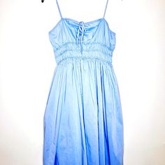 For The Woman That Is Booked And Busy, Brunch, Lunch, The Derby, Or High Tea, This Dress Will Fit All Your Spring And Summer Occasions. It Is Fully Lined, With Adjustable Spaghetti Straps. Made Of Self 65% Cotton And 38% Polyester, Lining 80% Polyester, 20% Cotton. The Measurements Are: Size Large, Pit To Pit 18 Inches, Waist 16 Inches, Length 40 Inches. The Bag And Hat Featured In The Photos Are Available For Purchase In The Closet. This Item Is New With Tags. See Photos For More Details. Light Blue Sundress With Spaghetti Straps, Blue Ruched Sleeveless Sundress, Light Blue Midi-length Sundress, Blue Smocked Bodice Dress For Casual Wear, Light Blue Ruched Beach Dress, Blue Dress With Smocked Bodice For Casual Wear, Light Blue Ruched Dress For Beach, Cotton Dress With Smocked Bodice And Spaghetti Straps, Blue Dress With Smocked Bodice And Spaghetti Straps